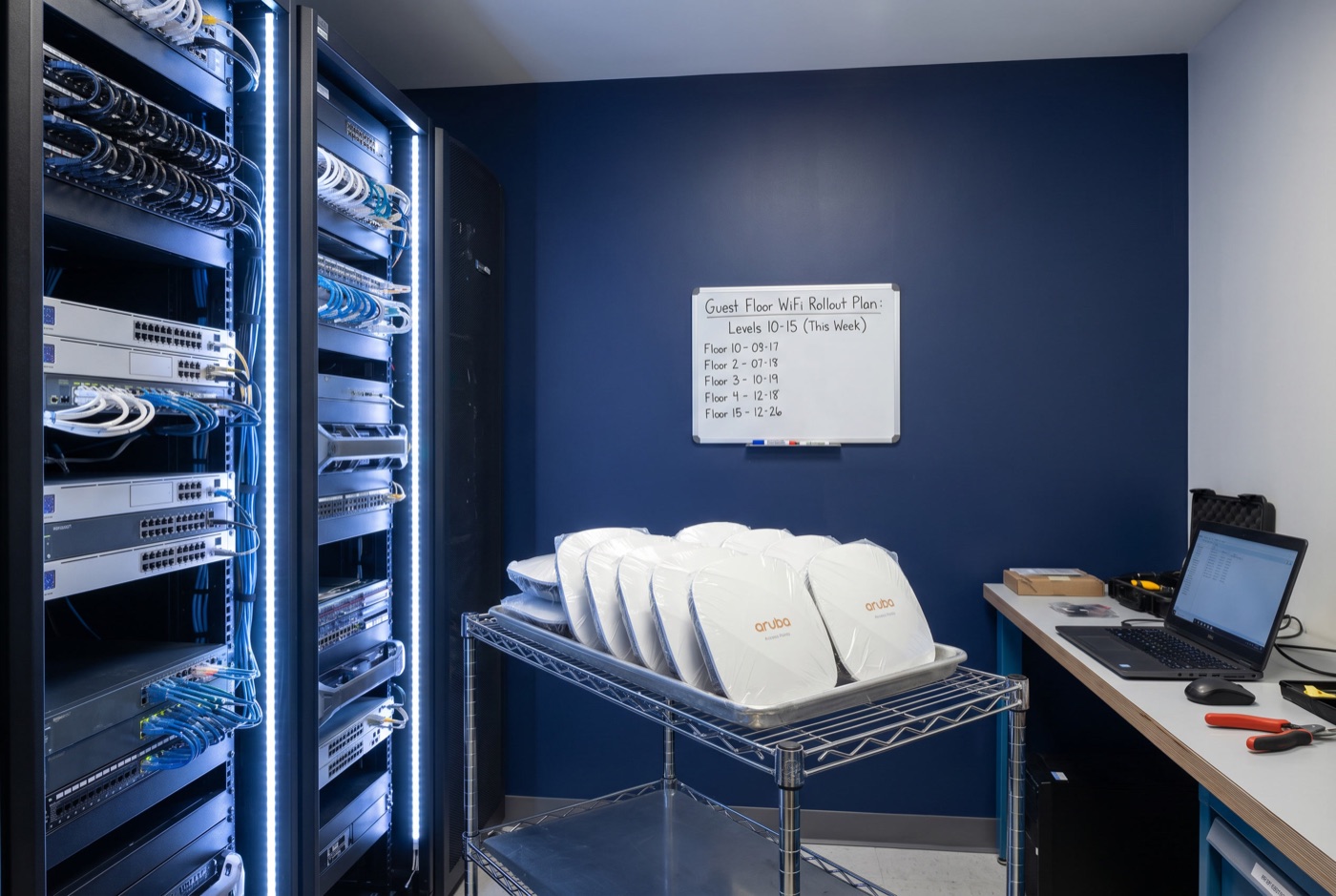 Hotel back-of-house IT room with Aruba access points staged for deployment