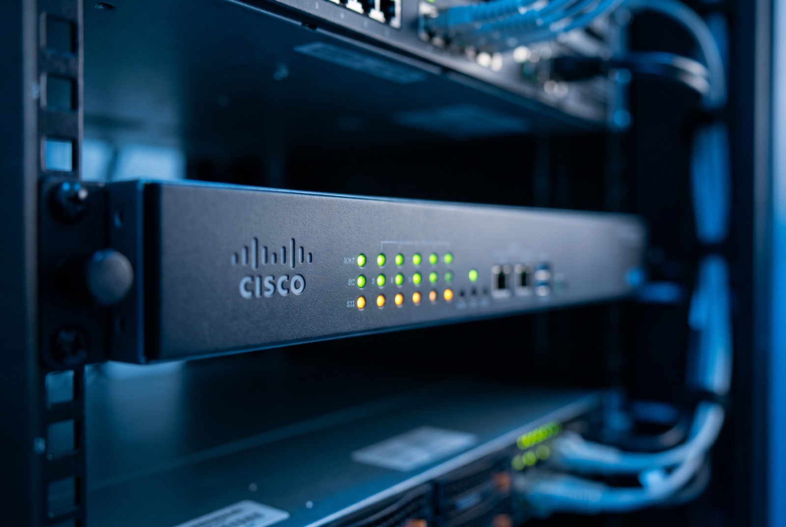 Rack-mounted Cisco Firepower firewall with green and amber status LEDs
